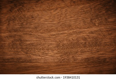 Dark brown with remnants of black paint wooden background texture