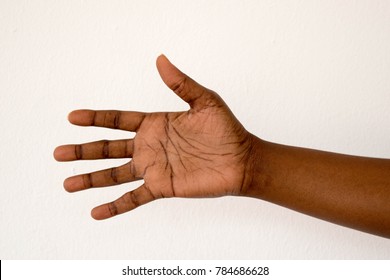 Dark Brown Skin Woman's Hand Open Palm Facing Isolated On White