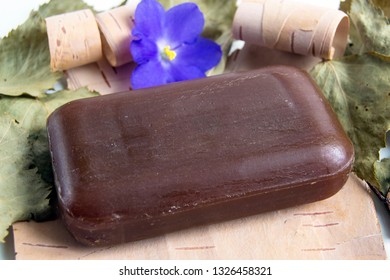 Dark Brown Soap, With The Addition Of Birch Tar, Lies On The Bark Of Birch. Personal Hygiene Products.