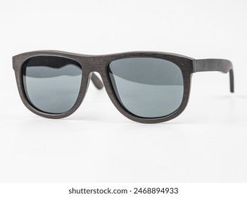 Dark Brown Solar bamboo sunglasses wood isolated on white background with shadow. - Powered by Shutterstock