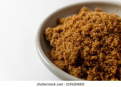 Dark Brown Sugar On A White Background