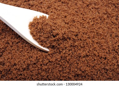 Dark Brown Sugar  And Wooden Spoon