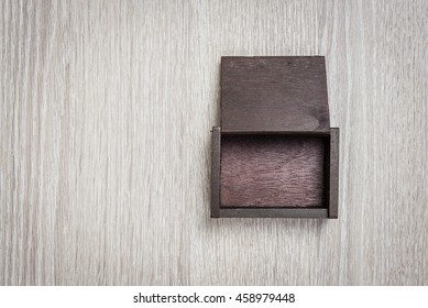 Dark Brown Wood Box On Wooden Background.