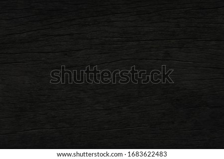 Dark brown wood with a rough surface  for texture and background