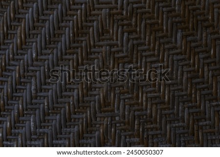 dark brown woven bamboo texture, woven bamboo pattern on the old chair.