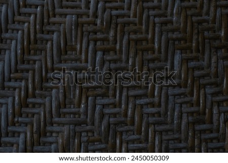 dark brown woven bamboo texture, woven bamboo pattern on the old chair.