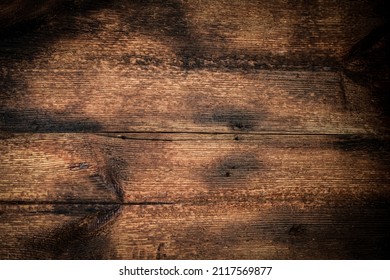 Dark burnt wood background from old boards. - Shutterstock ID 2117569877