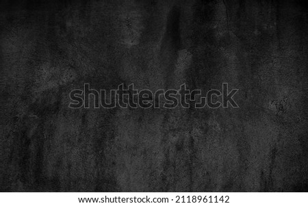 Dark cement wall in retro concept. Black concrete background for wallpaper or graphic design. Blank old plaster texture in vintage style. Abstract surface with unusual beautiful patterns.