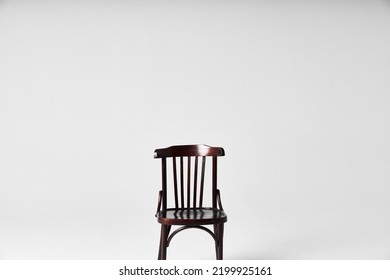 Dark Chair On Cyclorama Under Flash Light