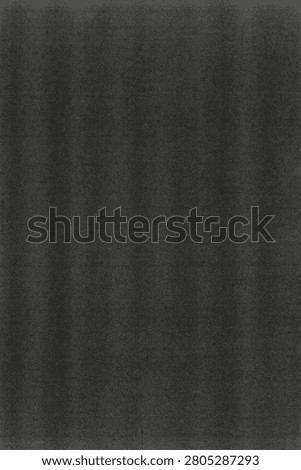 A dark charcoal gray surface filled with a fine even grain across the whole frame. Soft cloudy patches of slightly lighter gray drift through the field, creating gentle tonal variation against the deeper background. Faint diagonal streaks and brush like marks sweep across the surface, adding a subtle sense of movement. A scattering of tiny specks and light flecks breaks up the muted texture. The overall look is deep and moody with a matte finish and smooth low contrast