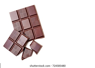 Dark Chocolate Bar And Cubes Isolated On White Background, Top View