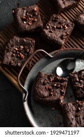 Dark Chocolate Brownies With Choco Drops On Old Metal Tray Overhead View