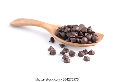 Dark Chocolate Chips In Spoon Isolated On White Background.