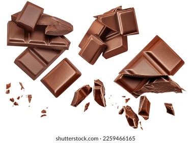 Dark chocolate chunks isolated on white background. Collection. Flying Chocolate pieces, shavings and cocoa crumbs Top view. Flat lay. Pattern