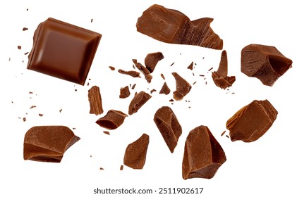  Levitating dark chocolate chunks isolated on white background. Broken chocolate bar pieces and cocoa crumbs explotion. Chocolate flakes and  chips Top view. Flat lay.
