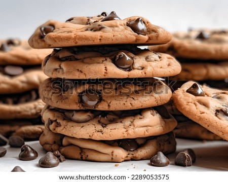 Dark chocolate cookies home made stacked with chocolate chips on a white background