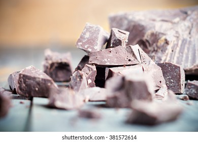Dark chocolate pieces , chocolate candy, cocoa. Shallow DOF. With toning - Shutterstock ID 381572614