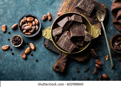Dark Chocolate Pieces Crushed And Cocoa Beans, Top View