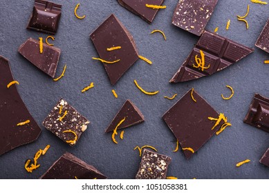 Dark Chocolate Slices With Orange Zest Pattern, Top View