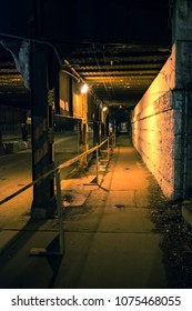 Dark City Alley Industrial Bridge Underpass With Caution Crime Scene Tape At Night