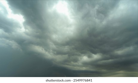 Dark clouds covered the sky before it started raining