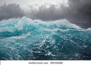 Dark clouds and crashing ocean waves during storm in the atlantic ocean