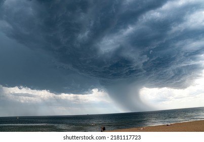 Dark clouds and dramatic storm over a bay.