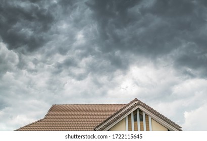 Dark Clouds Going To Heavy Rain Over The House Roof.