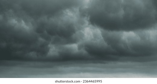 dark clouds make sky in black. Heavy rain thunderstorm . Pattern of clouds overcast predict tornado, Hurricane or thunderstorm and rainy.
