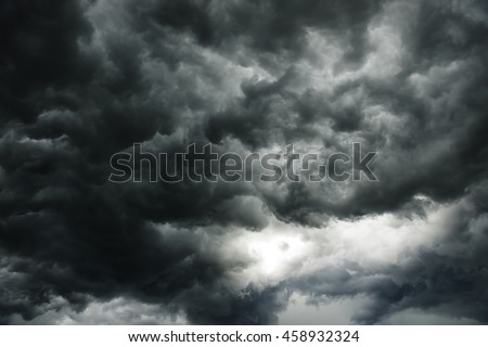 the dark clouds make the sky in black. The rain is coming soon. Pattern of the clouds can not predict this is  tornado, Hurricane or thunderstorm. Sometimes heavy clouds but no rain