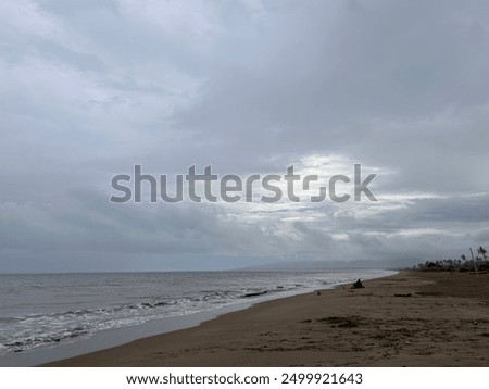 Dark clouds over the beach before the rain 