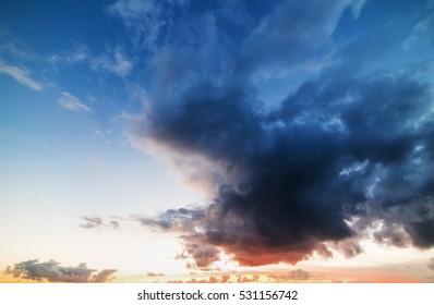 dark clouds in the sky at sunset