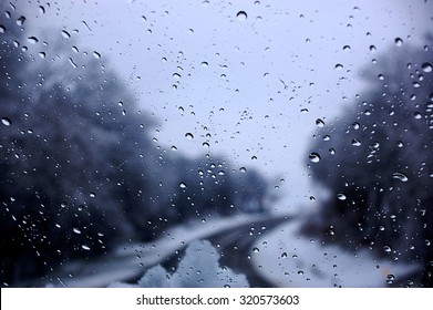 Dark Clouds And  Snow Storm Viewed Through Car Window