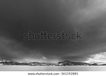 Dark and cloudy black and white sky over the mountains near Frisco, Colorado.