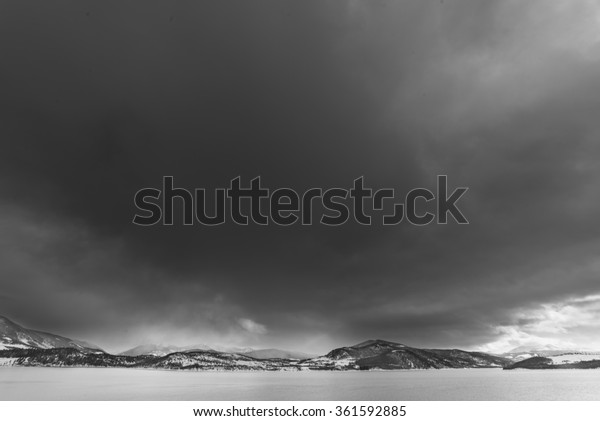 Dark and cloudy black and white sky over the\
mountains near Frisco,\
Colorado.