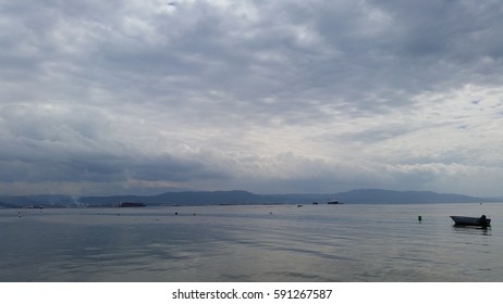 Dark Cloudy And Rainy Beach