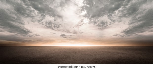 Dark Concrete Floor Background with Scenic Night Sky Horizon and Dramatic Clouds - Shutterstock ID 1697703976