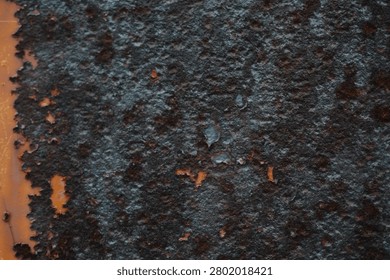 Dark Corroded Metal Surface with Rust Texture and Peeling Paint