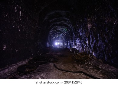 Dark Creepy Abandoned Coal Mine In Backlight.