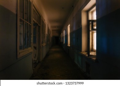 Dark Creepy Corridor Of Abandoned Hospital At Night. Horror Concept.