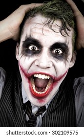 Dark creepy joker face screaming angry - Shutterstock ID 302109575