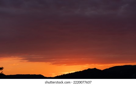 Dark Crimson Dusk Cloudy Sky. Cloudscape With Copy Space.