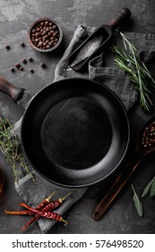 dark culinary background with empty black pan and space for text recipe or menu
