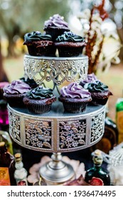 Dark Cupcakes on a Serving Tray in Jewel Tones for Spooky Desserts