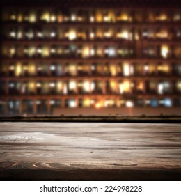 Dark Desk Of Wood And City In Night 