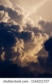 Dark and dramatic cumulus clouds forming into thunderstorm