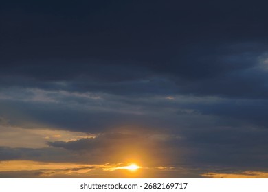 Dark dramatic sky with thick clouds after sunset