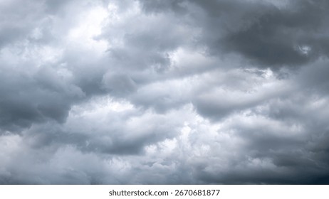 Dark dramatic sky with thunder stormy clouds before rain. A storm is brewing. The sky is looking ominous. - Powered by Shutterstock - Get 15% off with code: PIKWIZARD15