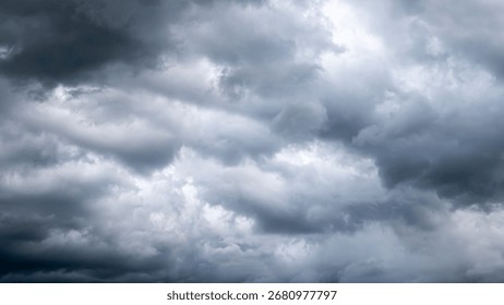 Dark dramatic sky with thunder stormy clouds before rain.  A storm is brewing. The sky is looking ominous.