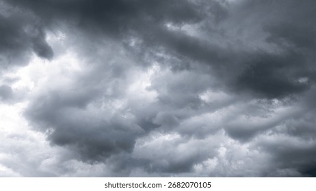 Dark dramatic sky with thunder stormy clouds before rain. A storm is brewing. The sky is looking ominous.